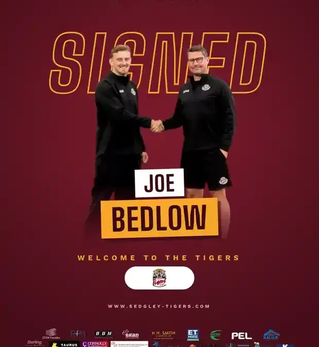 Joe Bedlow shakes hands after signing for Sedgley Park Tigers for the 2026/27 season