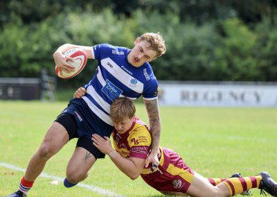 Ball carrier breaks a tackle during Sedgley Park against Sheffield at Park Lane
