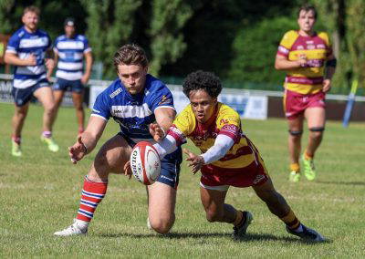 A player gets the offload away in the tackle during Sedgley Park against Sheffield at Park Lane