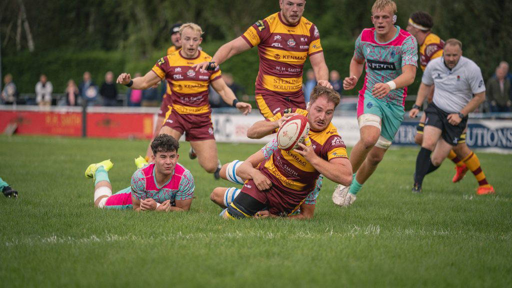 A Sedgley Park ball carrier breaks through the Darlington Mowden Park defence at Park Lane