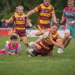 A Sedgley Park ball carrier breaks through the Darlington Mowden Park defence at Park Lane