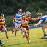 A Sedgley Park Tigers ball carrier hands off a Tynedale defender and breaks through the line