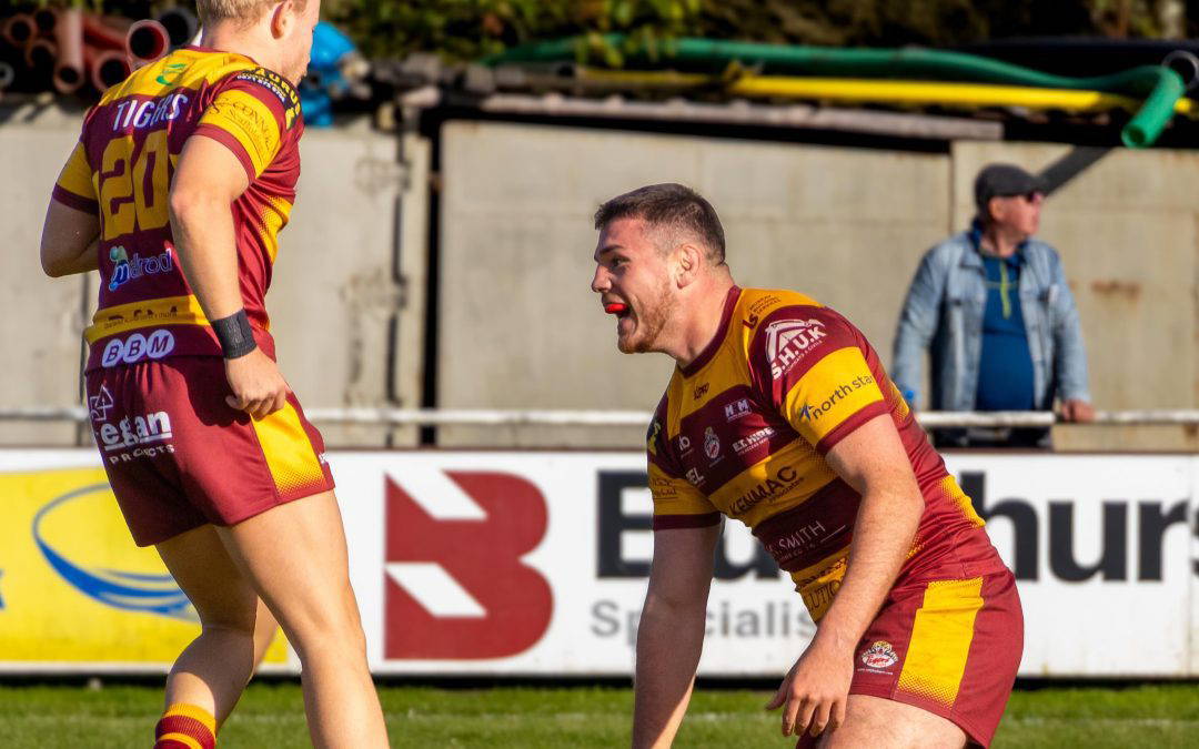 A Sedgley Park forward grounds the ball for a try against Huddersfield at Park Lane