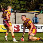 A Sedgley Park forward grounds the ball for a try against Huddersfield at Park Lane