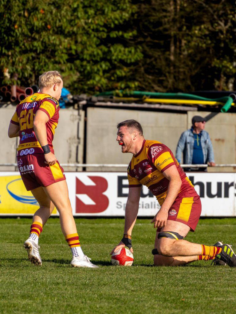 A Sedgley Park forward grounds the ball for a try against Huddersfield at Park Lane